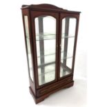 MAHOGANY DISPLAY CABINET with a shaped raised back above a moulded top with a pair of arched glass