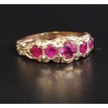 GRADUATED RUBY FIVE STONE RING the central ruby approximately 0.3cts, in scroll decorated setting