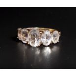GRADUATED QUARTZ FIVE STONE RING the oval cut quartz gemstones on ten carat gold shank, ring size P