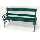 CAST IRON GARDEN BENCH with ornate end supports and a slatted wooden back and seat, 153cm long