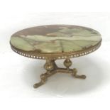 ALABASTER OCCASIONAL TABLE the circular top on a gilt metal base with three columns and three