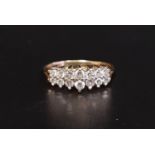 DIAMOND CLUSTER RING the two rows of diamonds in stepped setting totaling approximately 0.5cts, on