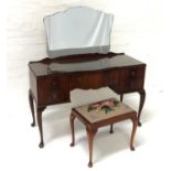 BEITHCRAFT MAHOGANY BOW FRONT DRESSING TABLE with a shaped mirror back above a central shaped drawer