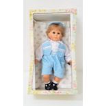 ITALIAN FIBA DOLL of a young boy with a Royal blue waistcoat, shorts and matching hat, marked to