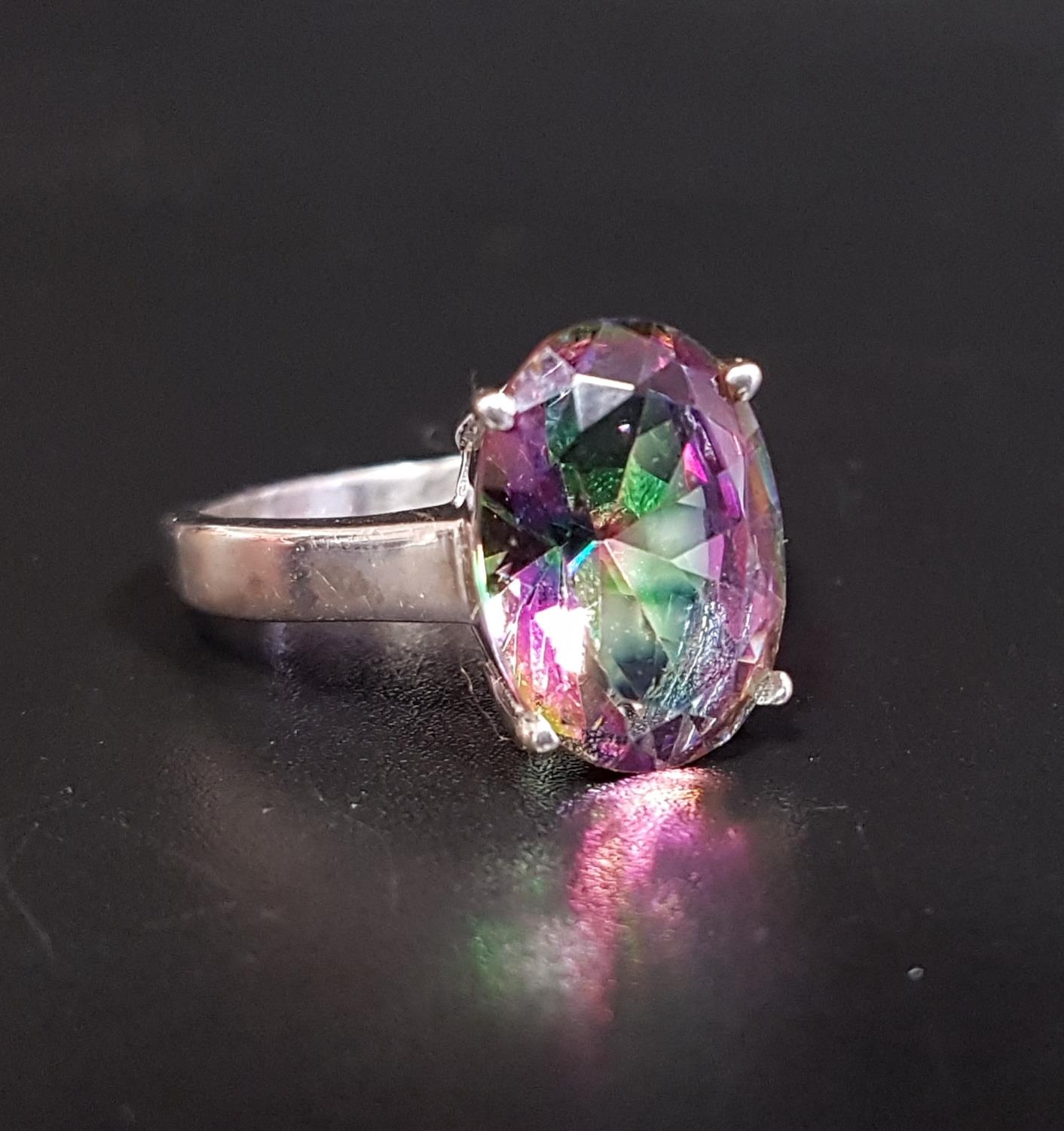 MYSTIC TOPAZ SINGLE STONE RING the oval cut topaz approximately 5.5cts, on silver shank, ring size P