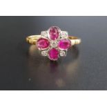 RUBY AND DIAMOND CLUSTER RING the four oval cut rubies separated by small diamonds, on nine carat