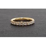 DIAMOND HALF ETERNITY RING the eleven round brilliant cut diamonds totaling approximately 0.44cts,