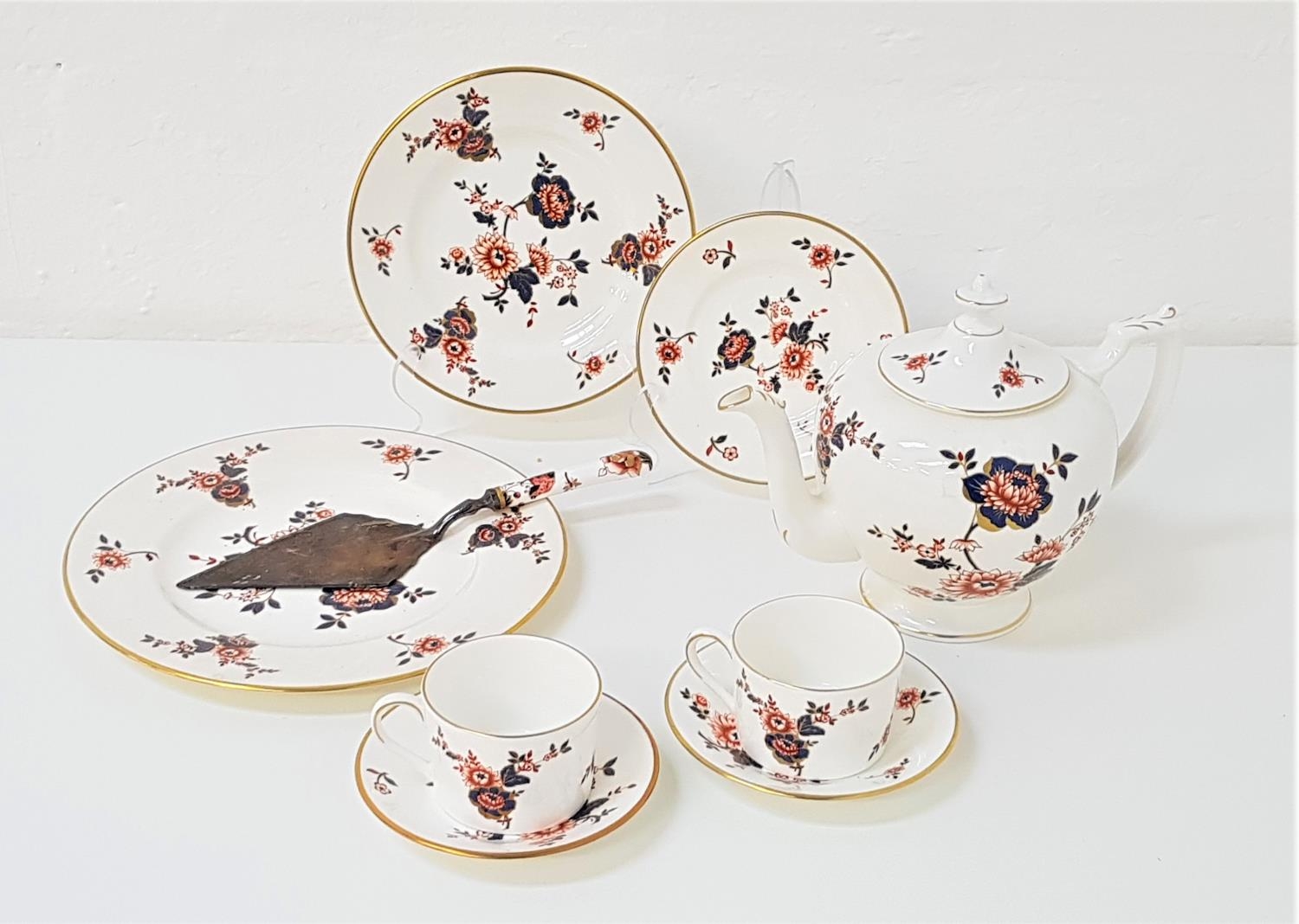 COALPORT TEA SERVICE decorated in the Khotar pattern, comprising tea pot, cups and saucers, side