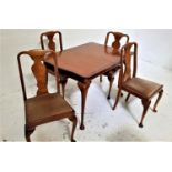 BURR WALNUT AND CROSSBANDED DINING TABLE AND FOUR CHAIRS the table with a shaped pull apart top
