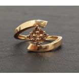 FANCY DIAMOND CLUSTER RING the nine diamonds in rhomboid shaped setting, on nine carat gold shank