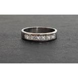 DIAMOND SEVEN STONE RING the channel set round brilliant cut diamonds totaling approximately 0.