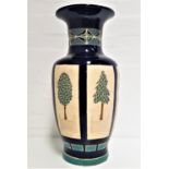 CONTINENTAL POTTERY VASE of baluster form with a blue ground, the neck decorated with a green