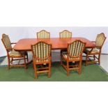 YEW AND CROSSBANDED DINING TABLE AND SIX CHAIRS the table with a rectangular top and extra leaf,