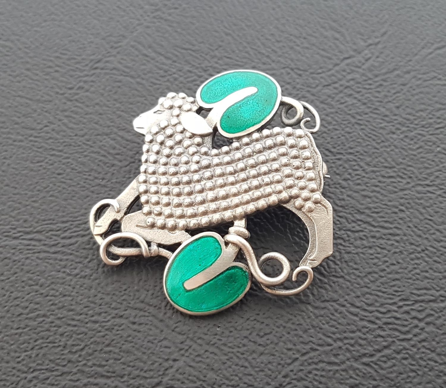 GEORG JENSEN DANISH SILVER LAMB BROOCH the lamb with beaded body set between two green enamel