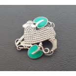 GEORG JENSEN DANISH SILVER LAMB BROOCH the lamb with beaded body set between two green enamel