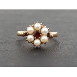 GARNET AND PEARL CLUSTER RING the central round cut garnet in six pearl surround, on nine carat gold