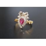 UNUSUAL RUBY AND DIAMOND CLUSTER RING the pear cut ruby in diamond surround and surmounted by a