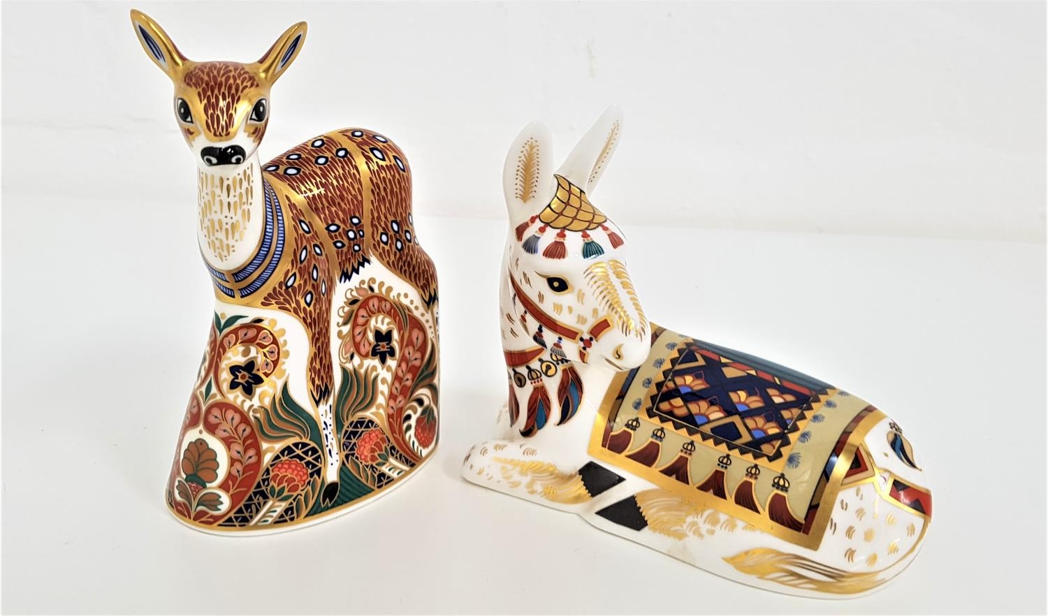 TWO ROYAL CROWN DERBY PAPERWEIGHTS both with buttons, a Fawn, 13.5cm high, and a recumbent donkey,