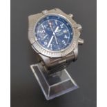 BREITLING CHRONOMETRE AVENGER WRISTWATCH with a titanium case, bezel and bracelet, the circular blue