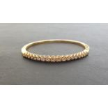 DIAMOND SET EIGHTEEN CARAT GOLD BANGLE the hinged bangles set with graduated round brilliant cut