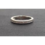 DIAMOND HALF ETERNITY RING the channel set princess cut diamonds on fourteen carat white gold shank,