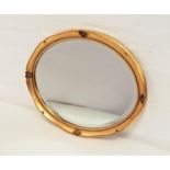 OVAL GILTWOOD WALL MIRROR with an oval beveled plate, 56.5cm wide