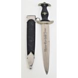 GERMAN WWII SS OFFICERS DRESS DAGGER with a black ebony handle inset with the enamel SS runes and