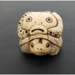 IVORY NETSUKE of a tortoise with an octopus on it's back, with character marks to base, 5.5cm long