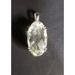 ZOIZITE SINGLE STONE PENDANT the oval checkerboard cut gemstone measuring approximately 20.6mm x
