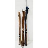 THREE SPINNING RODS comprising Shakespeare carbon 2.7m, black arrow and 7ft 6" split cane fishing