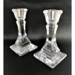 PAIR OF TIFFANY AND GO. CRYSTAL GLASS CANDLESTICKS raised on tapering square bases, 18cm high