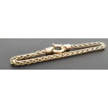 NINE CARAT GOLD FANCY LINK BRACELET with large decorative ring clasp, approximately 19cm long and