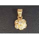 DIAMOND SET FLOWER HEAD DESIGN PENDANT the seven diamonds totaling approximately 0.25cts, in