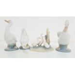 THREE NAO GEESE FIGURINES 14.5cm, 15cm and 11cm high, and a Nao group of three geese, 11.5cm high (