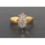 DIAMOND CLUSTER RING the multi diamonds totaling approximately 0.5cts, on eighteen carat gold shank,