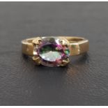 MYSTIC TOPAZ SINGLE STONE RING the oval cut topaz on nine carat gold shank, ring size O