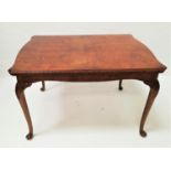 FIGURED WALNUT DINING TABLE with a shaped pull apart top and extra leaf, standing on cabriole