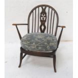 ERCOL STICKBACK ARMCHAIR the shaped back with a central splat above a pair of shaped arms with a