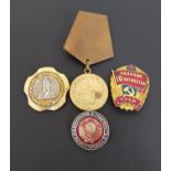 SOVIET RUSSIAN THE MEDAL FOR THE DEFENSE OF LENINGRAD together with three gilt metal and enamel