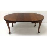 EDWARDIAN OAK EXTENDING DINING TABLE with D ends, two extra leaves and a wind out mechanism,
