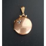 NINE CARAT GOLD LOCKET PENDANT the circular locket with seed pearl decoration, total weight