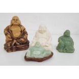FOUR FIGURES OF BUDDHA with three in resin and one in soap stone (4)