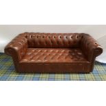 CHESTERFIELD SOFA in brown leather with a button back, arms and seat, with decorative stud detail,
