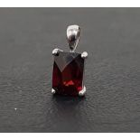 GARNET SINGLE STONE PENDANT the rectangular checkerboard cut garnet in unmarked white gold mount,