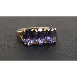 TANZANITE AND DIAMOND RING the three oval cut tanzanites in pierced setting with diamonds to the