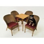 LLOYD LOOM STYLE TABLE AND CHAIRS the table with a gold painted woven cane top, standing on turned