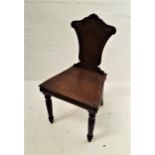 VICTORIAN OAK HALL CHAIR with a shaped carved back above a solid seat with a carved frieze below,