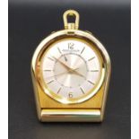 JAEGER-LeCOULTRE GILT METAL FOLDING TRAVEL ALARM CLOCK the dial with Arabic 12 and 6 together with