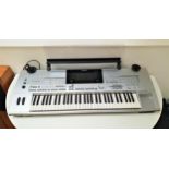 YAMAHA TYROS DIGITAL WORKSTATION KEYBOARD with a silver finish, shaped perspex music stand,