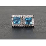 PAIR OF BLUE TOPAZ AND DIAMOND CLUSTER EARRINGS the central square cut blue topaz on each in diamond
